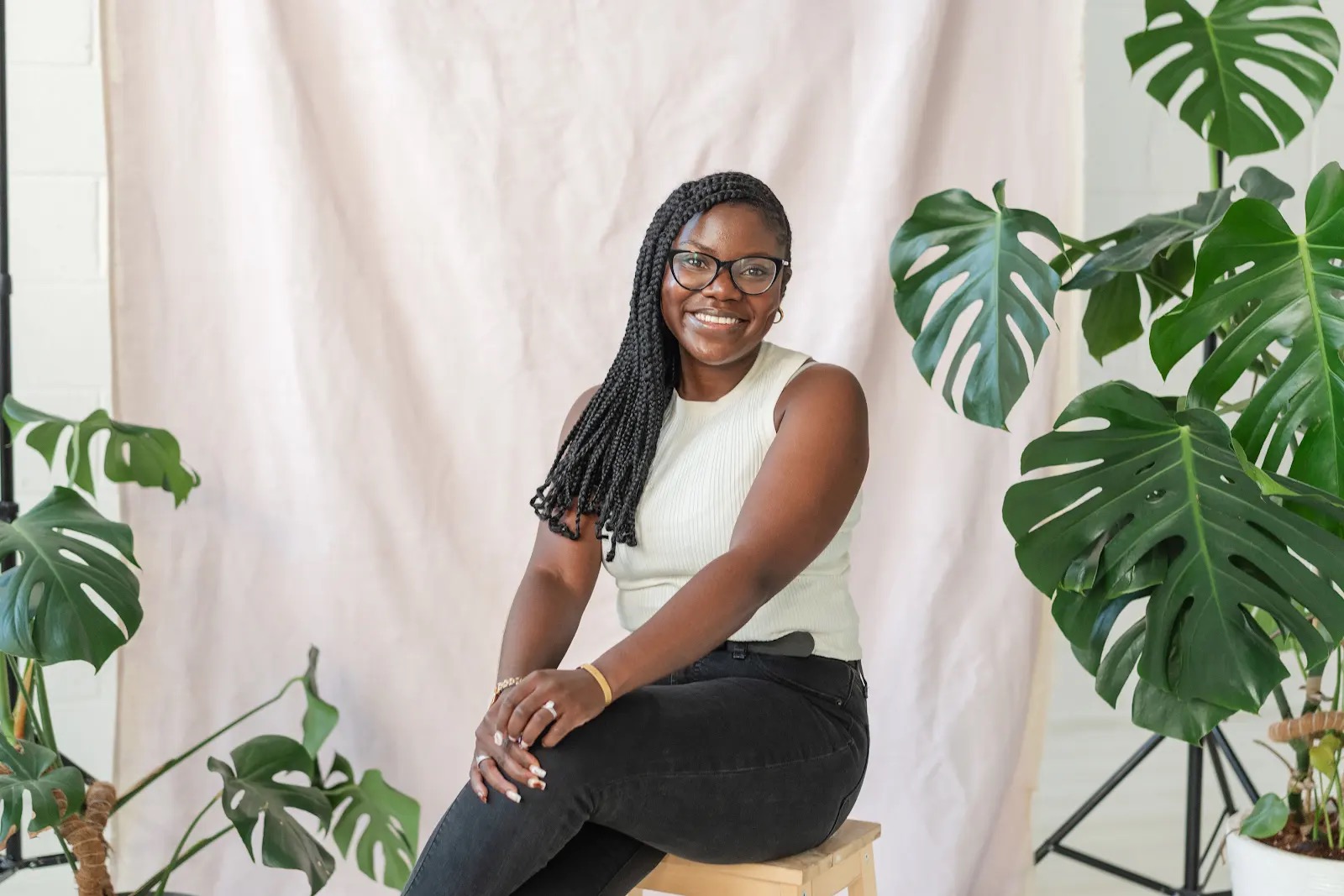 Chikumo smiling in a solo portrait at Thread Studio